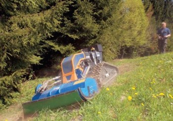 A Deltrak cutting grass